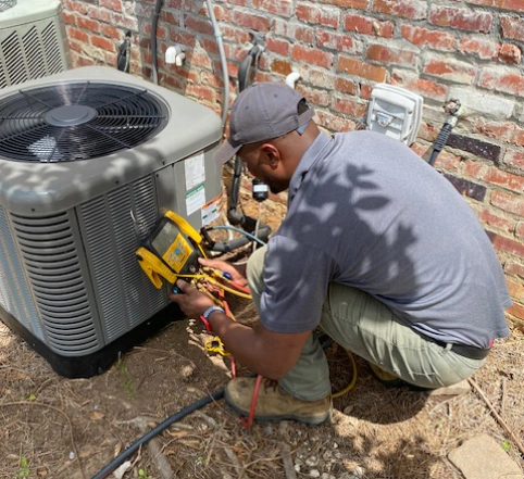 technician working on hvac unit